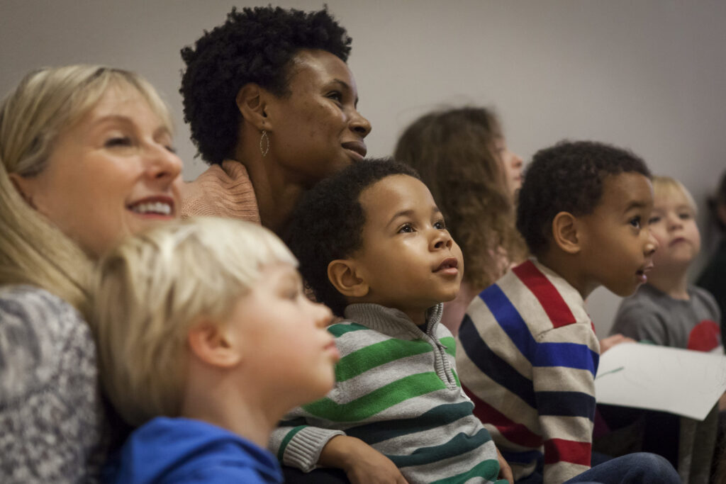 children and parents looking up.